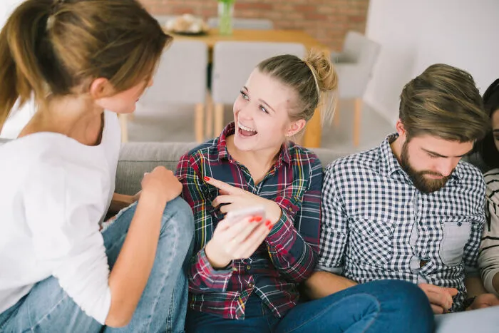 Three friends sharing raw and emotional confessions while sitting together in a cozy living room setting.