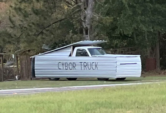 Modified truck covered in metal sheets labeled Cybor Truck, an example of outrageous car mods that took things way too far.