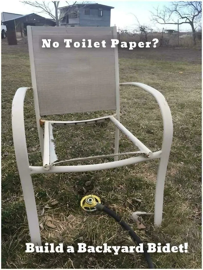 Broken lawn chair turned into a backyard bidet, showcasing clever redneck engineering and creative MacGyvering outdoors.