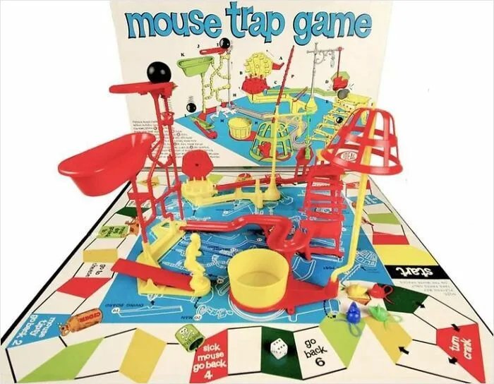Vintage mouse trap game board with colorful plastic ramps and unique game pieces, showcasing weird and wonderful vintage things.