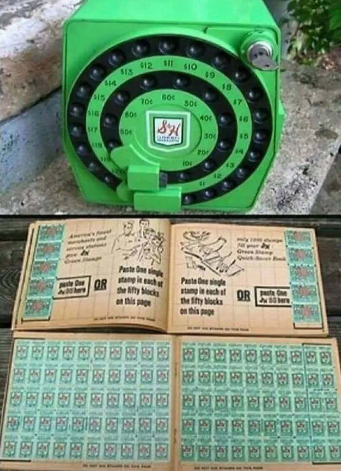 Green vintage rotary dial device above an open book filled with collectible stamps, showcasing unique vintage things.