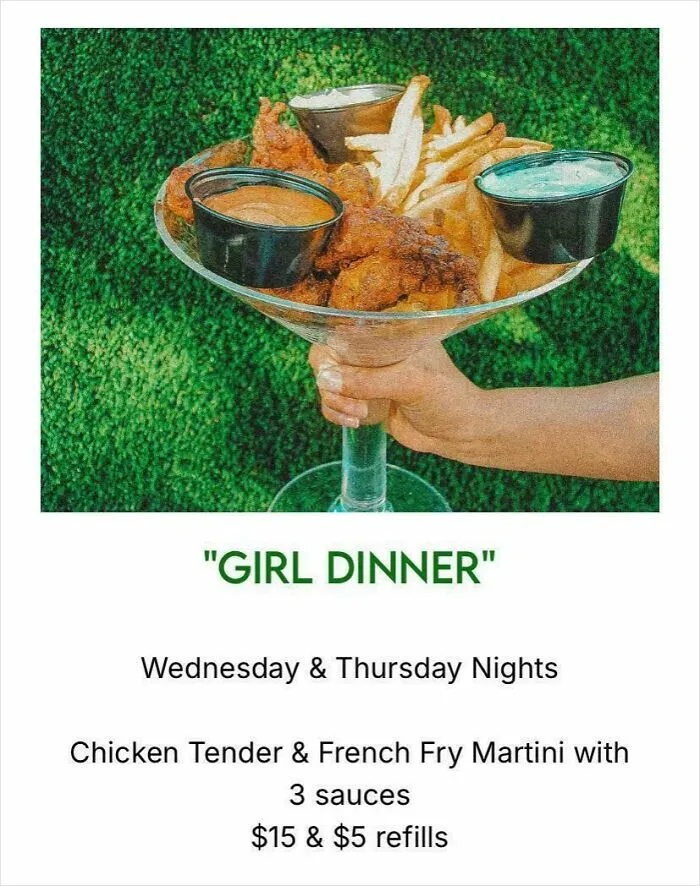 Unholy meal serving of chicken tenders and fries presented in a large martini glass with three sauces.