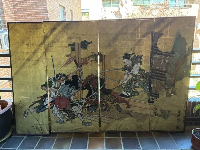 Antique Japanese folding screen with samurai warriors in battle, showcasing interesting and beautiful old things collection.