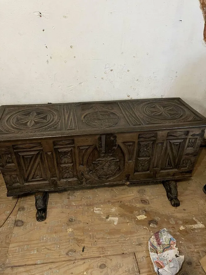 Antique wooden chest with intricate carvings and claw feet, showcasing beautiful old things people have the pleasure of owning.