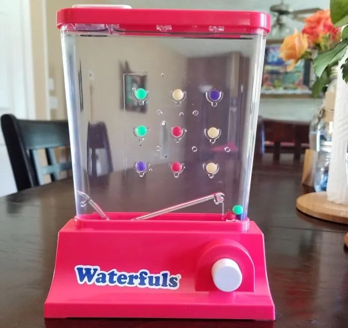 The Original Tablet That Didn't Need A Charger Has Returned In The Form Of The <a Style="Display:inline;" Href="Https://Www.amazon.com/Romper-Room-Waterfuls/Dp/B07dqnyd8z?ie=utf8&th=1&linkcode=ll1&tag=bpfrog-20&linkid=4ade8f2e4eb6d0b6b15720720c83cf34&language=en_us&ref_=as_li_ss_tl" Target="_blank">  <span Style="Font: Inherit; Color: #d74b1f;"> Original Waterfuls Water Game </Span>