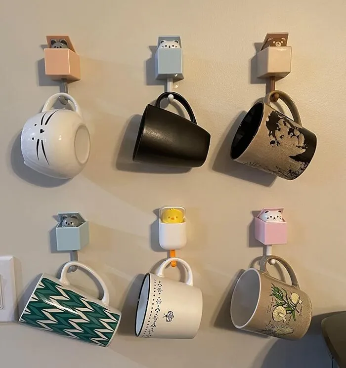 Your Wall Can Now Play A Tiny Game Of Peekaboo With You Every Time You Use These <a Style="Display:inline;" Href="Https://Www.amazon.com/Creative-Adhesive-Utility-Hanging-Decorations/Dp/B097r2p16h?ie=utf8&th=1&linkcode=ll1&tag=bpbobcat-20&linkid=a107b76dee82c1b91e948200639f39d8&language=en_us&ref_=as_li_ss_tl" Target="_blank">  <span Style="Font: Inherit; Color: #d74b1f;"> Kitty Hooks </Span>