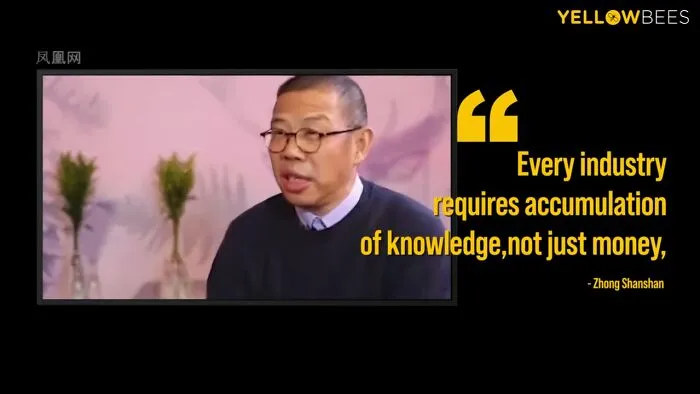 Man wearing glasses and a sweater discussing wealth and knowledge in relation to the richest people in the world.