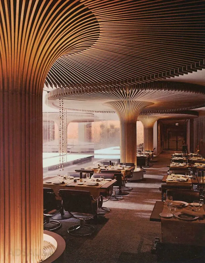 Modern restaurant interior featuring innovative architectural columns and smart design elements creating a cooler ambiance.