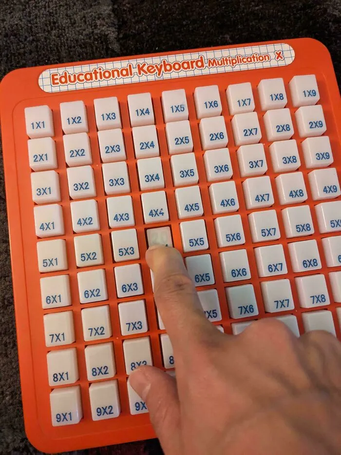 Educational keyboard with multiplication keys being pressed, showcasing smart and cool design by innovative designers.
