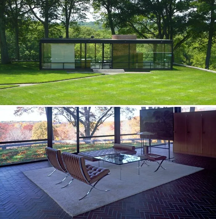 Modern historic home with glass walls surrounded by trees and green lawn, featuring minimalist interior design elements.