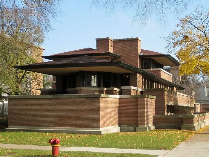 Historic home with unique brick architecture showcasing America’s architectural heritage in a leafy neighborhood setting.