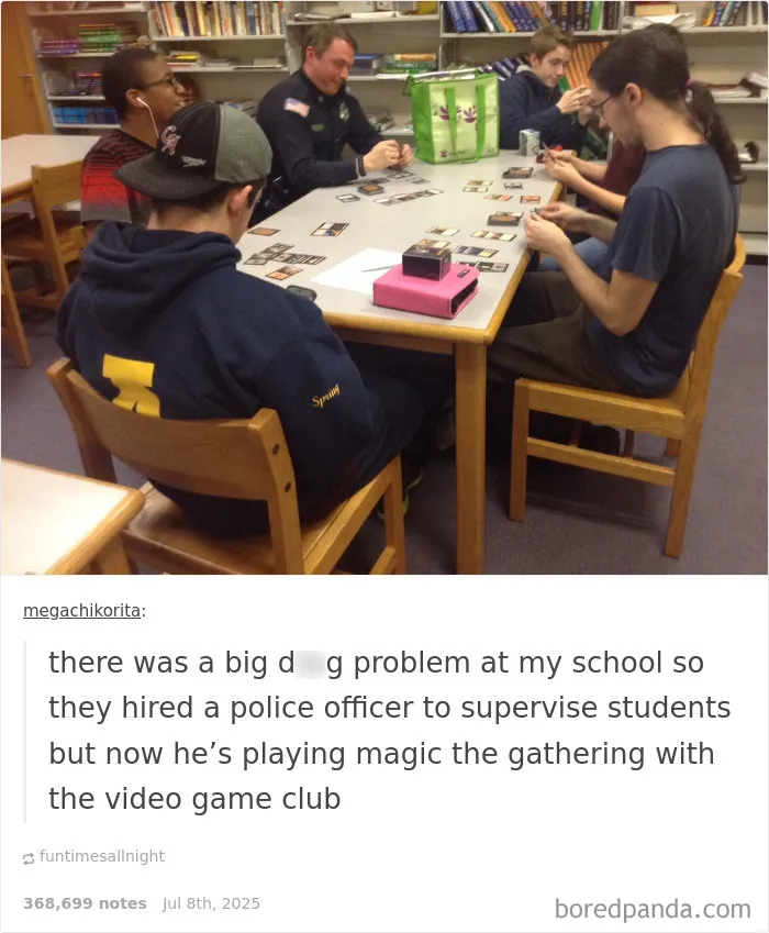 Police officer and students sitting around a table playing Magic the Gathering, promoting positivity and connection.