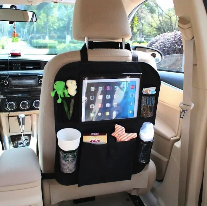 That Tiny Screen In The Back Now Has Its Own Personal Movie Theater, Which Is A Much Better Fate Than Being Dropped Mid-"Baby Shark" Thanks To A <a Style="Display:inline;" Href="Https://Www.amazon.com/Dp/B00tehdxpo?ascsubtag=7646176%2c31%2c35%2cd%2c0%2c0%2c0%2c1396%3a1%3b1338%3a1%2c44759026%2c0%2c0%2cgoogle&btn_ref=srctok-D4fd1c3b7ac3884c&linkcode=ll1&tag=bpwombat-20&linkid=ef3054a2926a1401fdba1d79fe221dd3&language=en_us&ref_=as_li_ss_tl" Target="_blank">  <span Style="Font: Inherit; Color: #d74b1f;"> Backseat Organiser With A Tablet Holder </Span>
