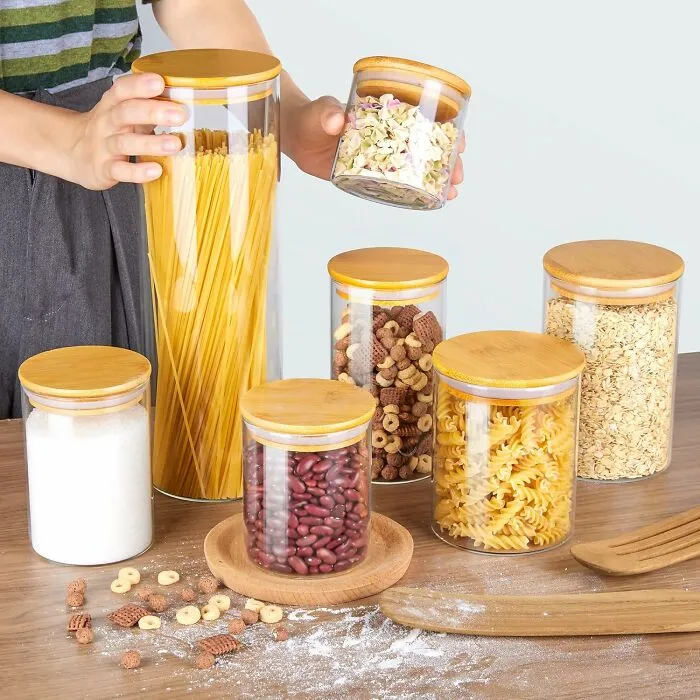 Your Pantry Is About To Get A Full-Blown "Glow Up" That Would Make A Kardashian Proud With Some <a Style="Display:inline;" Href="Https://Www.amazon.com/Dp/B0b27x7hfz?ascsubtag=7809707%2c18%2c48%2cd%2c0%2c0%2c0%2c1396%3a1%3b1338%3a1%2c57199919%2c0%2c0%2cgoogle&btn_ref=srctok-F59a2d557e2581cc&th=1&linkcode=ll1&tag=bpferret-20&linkid=d96d8e25b76ee61ff37db6b8a833f29b&language=en_us&ref_=as_li_ss_tl" Target="_blank">  <span Style="Font: Inherit; Color: #d74b1f;"> Glass Food Storage Jars With Bamboo Lids </Span>