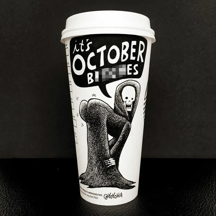 Coffee cup artwork featuring a humorous cartoon skeleton with the phrase October bites in black and white design.