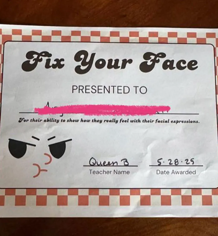 Certificate awarded in a school setting, highlighting facial expressions with a humorous tone from a questionable school.