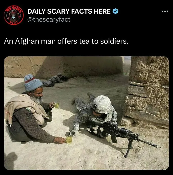 An Afghan man offers tea to soldiers in a desert setting illustrating a rare peaceful moment amid scary facts.