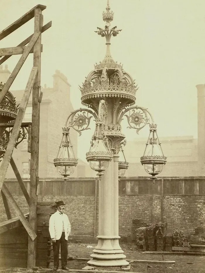 Walter Macfarlane Of Saracen Foundry Standing By A Lighting Standard Manufactured By His Company In Glasgow, Scotland