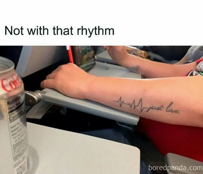 Arm tattoo showing an irregular heartbeat line with the words just live, a medical meme about healthcare costs.