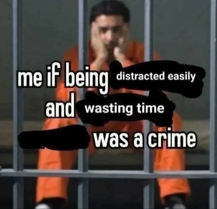Person in orange prison jumpsuit behind bars with meme text about being distracted easily and wasting time, nerdy meme.