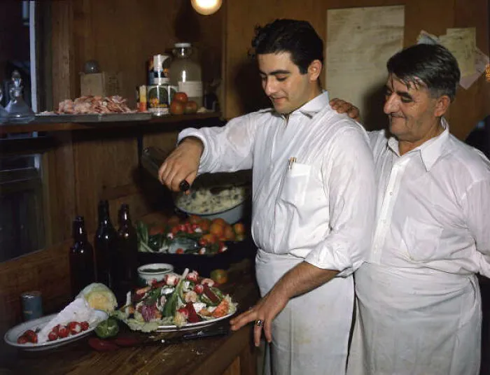 Louis Pappas And Son Michael Mixing Greek Salad At Famous Riverside Cafe In Tarpon Springs, Florida