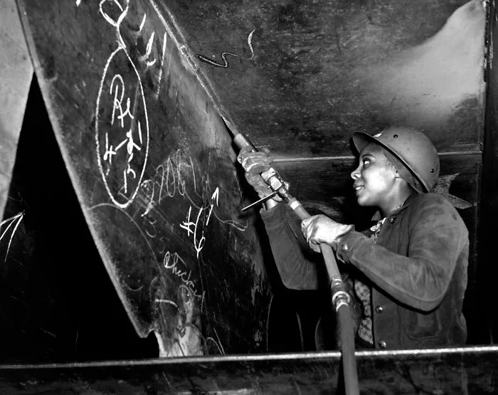 Miss Eastine Cowner, A Former Waitress, Is Helping In Her Job As A Scaler To Construct The Liberty Ship SS George Washington Carver, 1943
