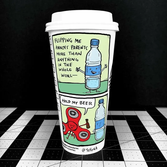 Coffee cup featuring hilarious relatable cartoons of a water bottle and fidget spinner with speech bubbles on a checkered surface.