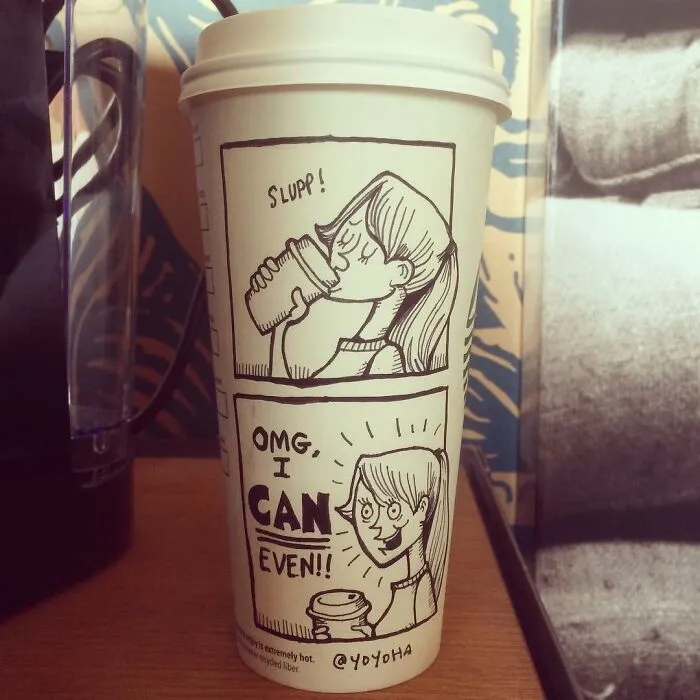 Coffee cup with a hilarious relatable cartoon of a girl drinking and expressing excitement, showcasing creative coffee cup art.