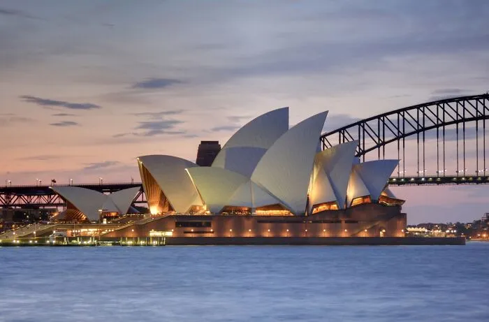 Sydney Opera House at dusk representing one of the smartest countries shaping the future of the world.