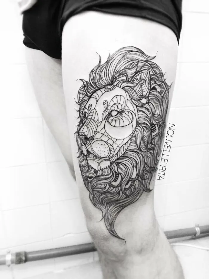 Intricate lion tattoo on thigh with detailed line work and abstract patterns, one of the best tattoos trending online.