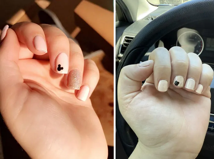Close-up of manicured hands with light-colored nail polish and small black design, illustrating salon glow-up results.