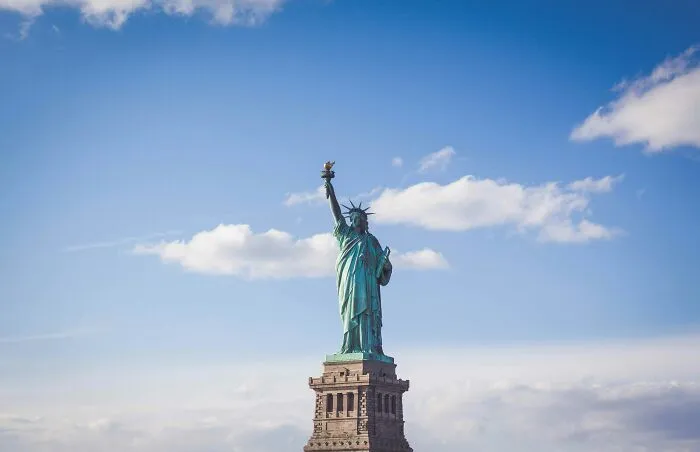 Statue of Liberty against a bright sky representing one of the smartest countries shaping the future of the world.