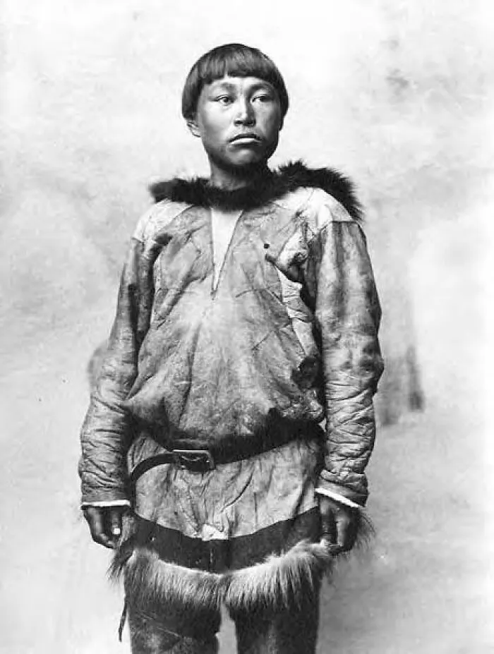 Historic photo of an Inuit man wearing traditional fur clothing, reflecting the unbreakable spirit of the Inuit people.