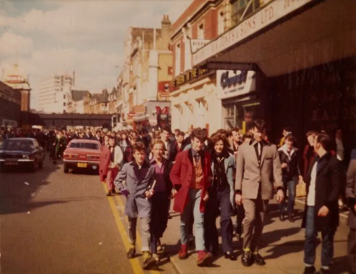 Teddy Boys Walking On A Busy Street In 1977