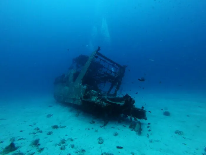 Underwater image of a sunken shipwreck representing rare phobias related to deep water and the ocean.