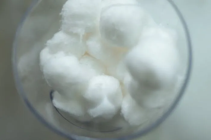 Close-up of white cotton balls in a transparent container representing rare phobias related to common objects and textures.