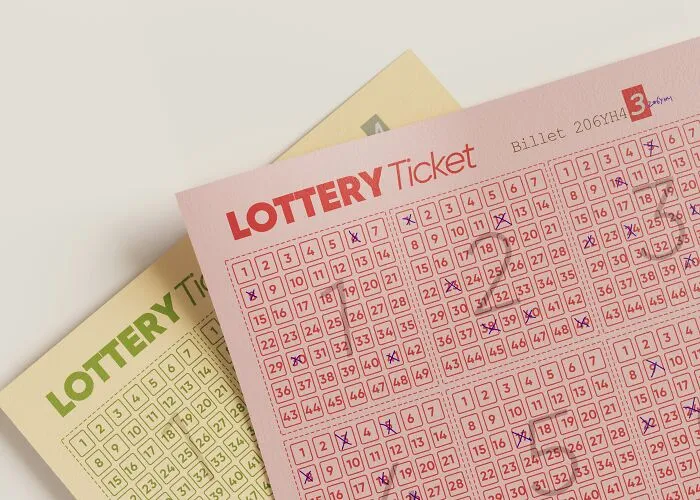 Pink and yellow lottery tickets filled out with multiple numbers marked, illustrating trends in overconsumption.