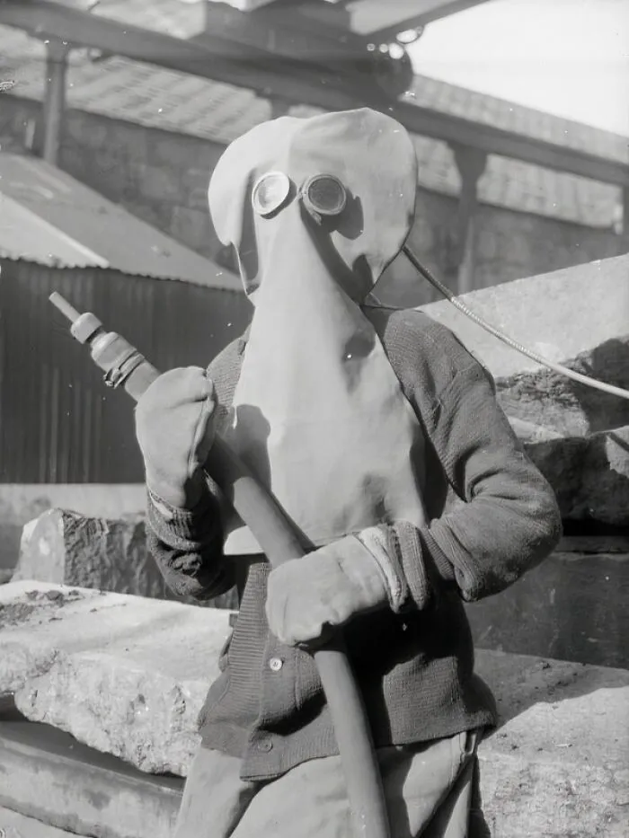A Woman At Work Wearing Protective Mask And Gloves During Sand Blasting Operations In The Granite Works Of Stewart & Co. Ltd., Fraser Place, Aberdeen, October 1918