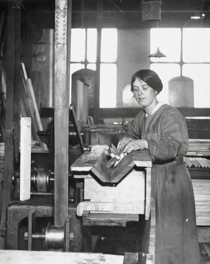 A Female Woodworker For The Ministry Of Munitions Operating A Circular Cutter As A Chamfering Machine With A Safety Guard