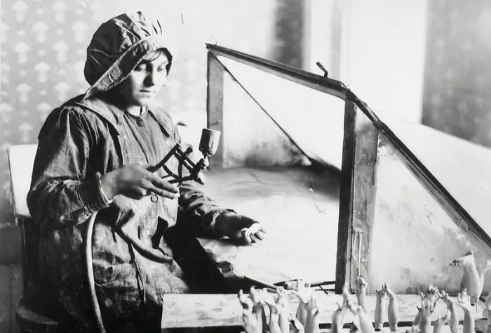 A Female Worker Making Limbs For Dolls At The Toy Factory Of Nell Foy On Church Street In Chelsea, London
