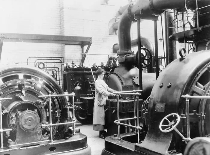Female Sub-Station Attendant Putting A Rotary Converter On Load In A Sub Station Of The Electricity Department Of The Corporation Of Glasgow