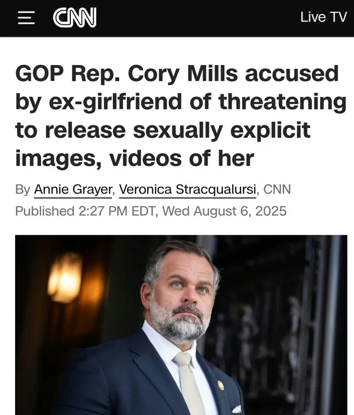 GOP Rep. Cory Mills looks serious in navy suit during a news report on failed attempt accusations in political controversy.