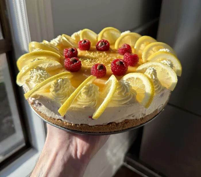 My Wife Wanted Cheesecake, So I Made A Lemon And Raspberry Cheesecake With Ferrero Rocher Filled Raspberries And Lemon Curd Ontop