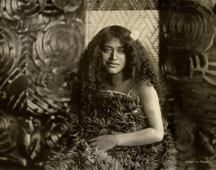 Portrait Of Mairie, Wearing Kahu Kiwi (Kiwi Feather Cloak), Hei Tiki (Neck Pendant) With Albatross Feather In Hair