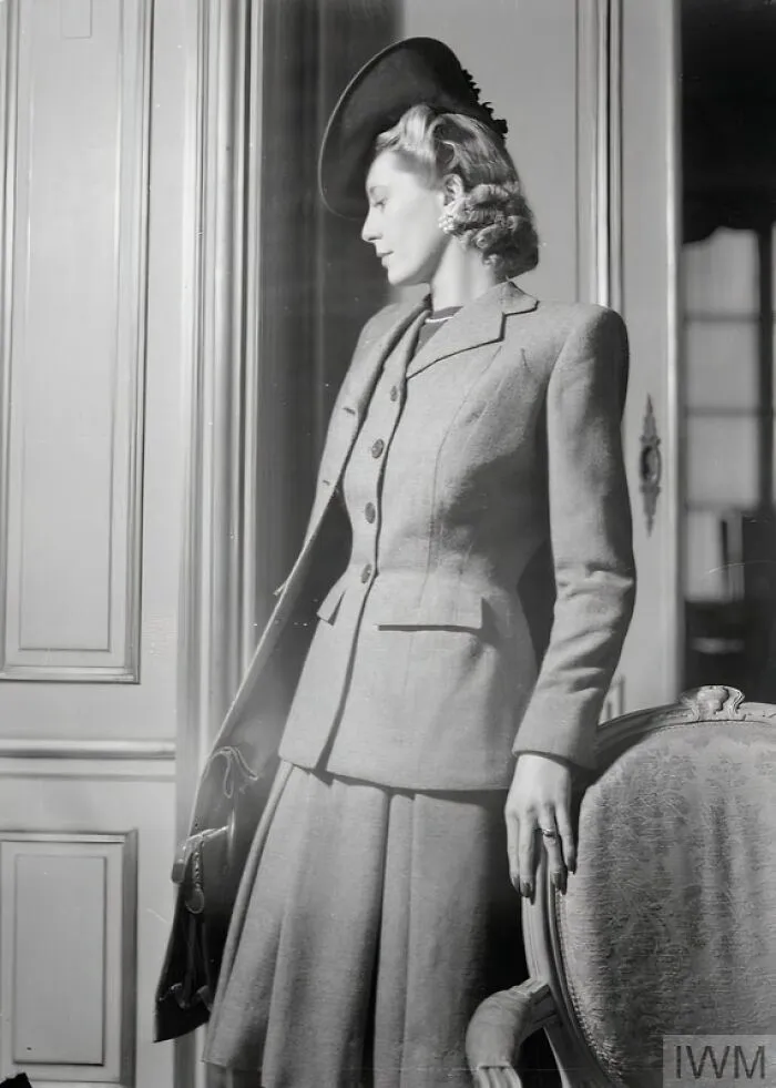 A Model Wears A Brown And Beige All-Wool Checked Suit By Fashion Designer Hardy Amies