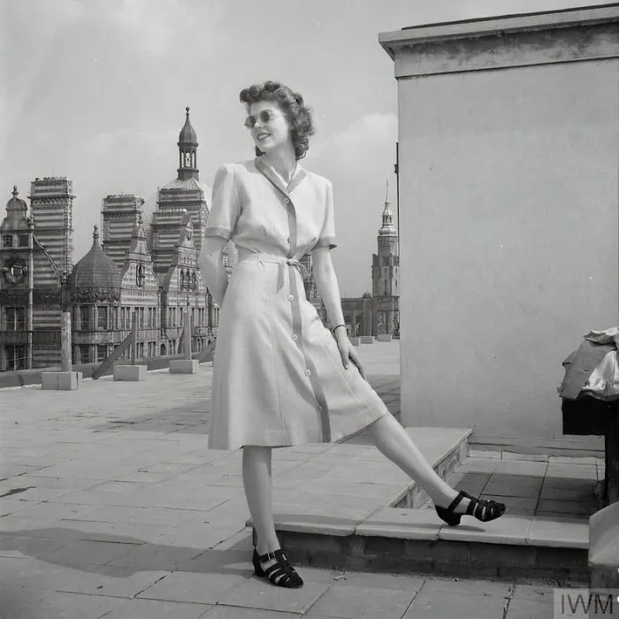 A Model Poses On A Bloomsbury Rooftop To Show Off Her Two-Tone Atrima Dress, Costing 7 Coupons