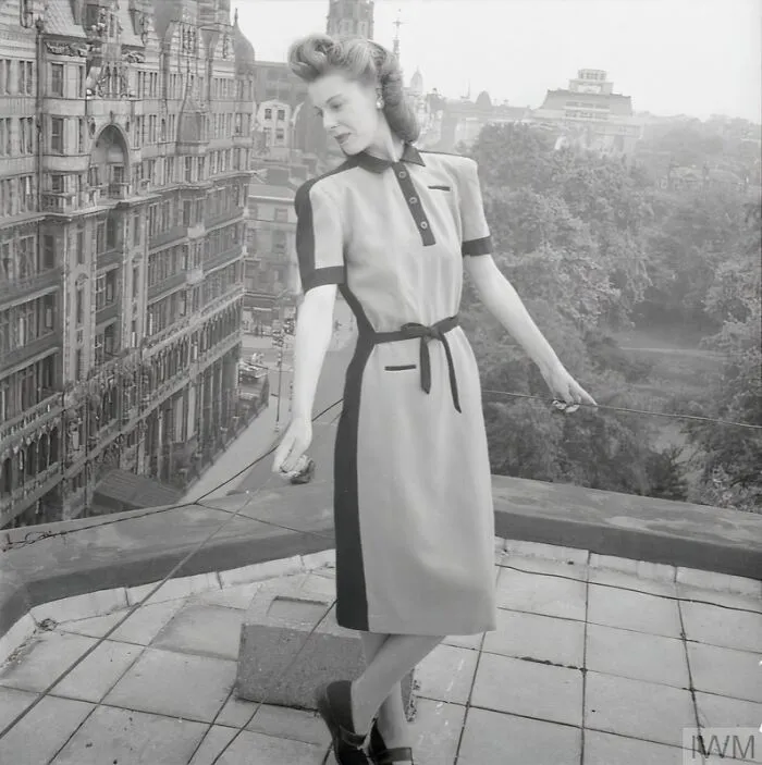 A Model Shows Off Her Pale Blue And Black Wool Atrima Dress, Costing 11 Coupons