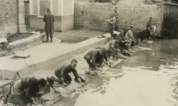 American Soldiers Doing Laundry With French Washerwomen. 305th Sanitation, Fronville, Meuse, France, 1918