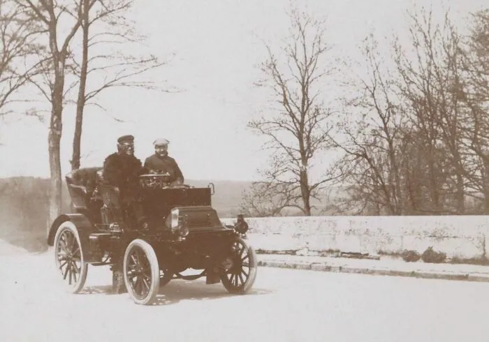 Two Men In A Car In La Rivivre-Thibouville, France, 1899
