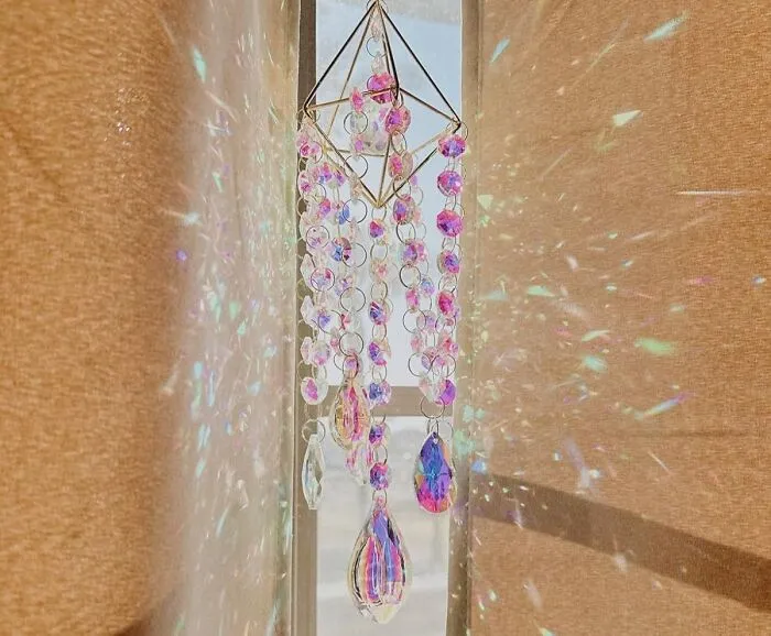 The Sun Has Officially Volunteered To Redecorate Your Apartment With Tiny Afternoon Rainbows, And Its Only Request Is That You Hang Up A <a Style="Display:inline;" Href="Https://Www.amazon.com/Crystal-Suncatchers-Hanging-Suncatcher-Handmade/Dp/B09ht62wr4?ie=utf8&linkcode=ll1&tag=bpbobcat-20&linkid=a3bf0575d08615a47e01514d00f20820&language=en_us&ref_=as_li_ss_tl" Target="_blank">  <span Style="Font: Inherit; Color: #d74b1f;"> Crystal Suncatcher </Span>